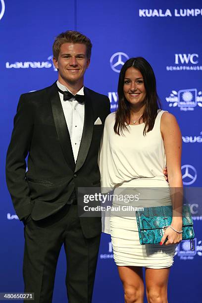 Nico Hulkenberg and girlfriend Laura attends the 2014 Laureus World Sports Awards at the Istana Budaya Theatre on March 26, 2014 in Kuala Lumpur,...