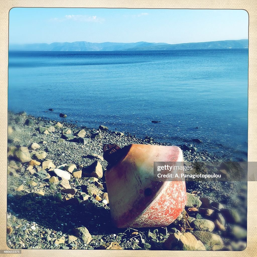 Buoy on beach in Limni, Evoia