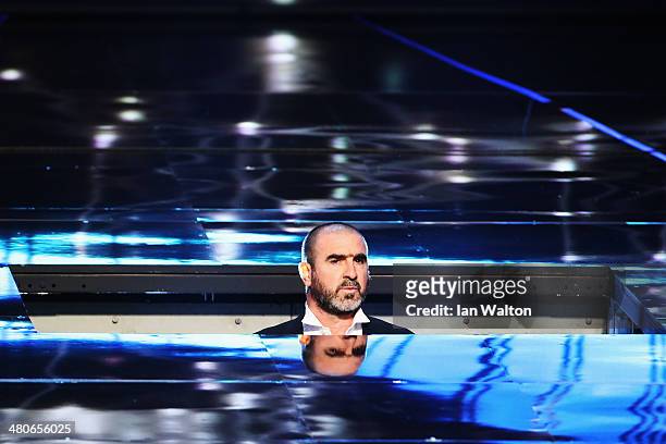 Eric Cantona arrives on stage during the 2014 Laureus World Sports Award show at the Istana Budaya Theatre on March 26, 2014 in Kuala Lumpur,...