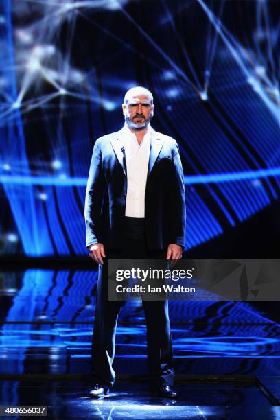 Eric Cantona arrives on stage during the 2014 Laureus World Sports Award show at the Istana Budaya Theatre on March 26, 2014 in Kuala Lumpur,...