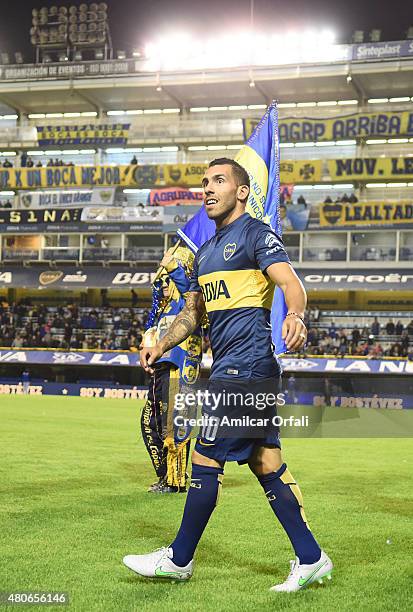 Carlos Tevez walks on the field during his presentation as new player of Boca Juniors at Alberto J. Armando Stadium on July 13, 2015 in Buenos Aires,...