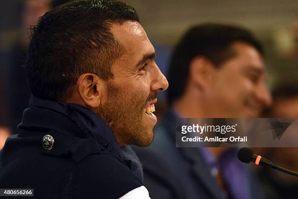 Carlos Tevez smiles during a press conference to present him as new player of Boca Juniors at Alberto J. Armando Stadium on July 13, 2015 in Buenos...