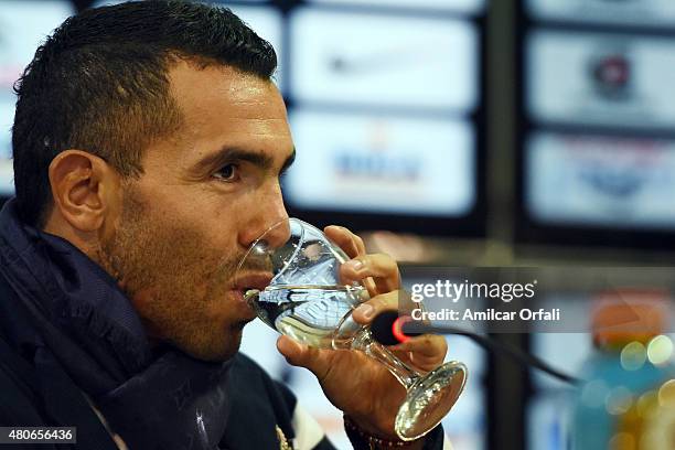 Carlos Tevez drinks water during a press conference to present him as new player of Boca Juniors at Alberto J. Armando Stadium on July 13, 2015 in...