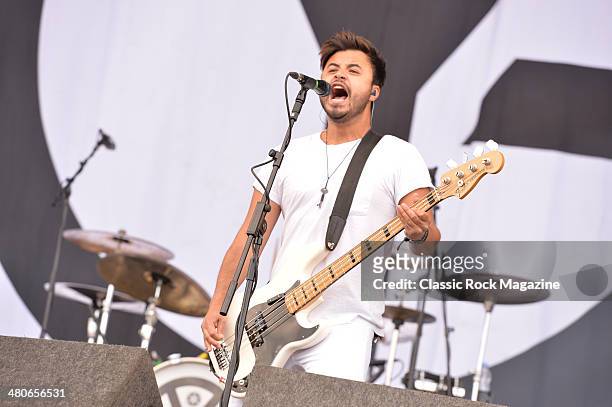 Bassist Simon Mitchell of English melodic hardcore group Young Guns performing live on the Main Stage at Download Festival on June 15, 2013.