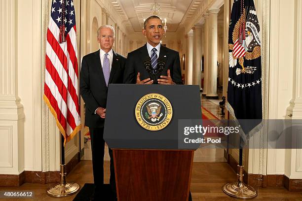 President Barack Obama, standing with Vice President Joe Biden, conducts a press conference in the East Room of the White House in response to the...