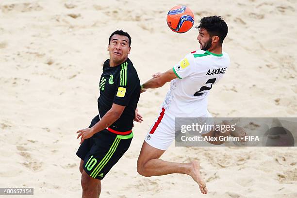 Amir Akrabi of Iran is challenged by Abdiel Villa of Mexico during the FIFA Beach Soccer World Cup Portugal 2015 Group C match between Mexico and...