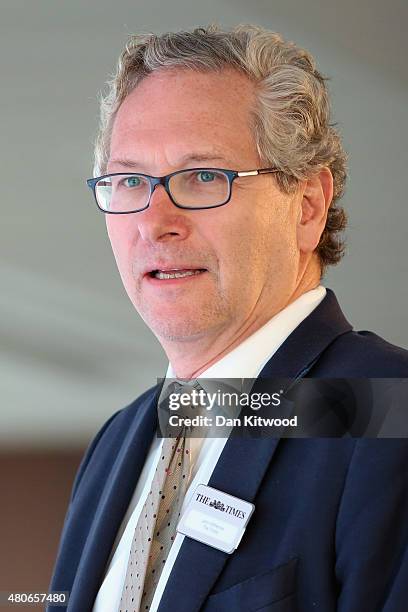 John Witherow, the Editor of the Times newspaper, prepares to announce British Prime Minister David Cameron onto the stage to takes questions during...