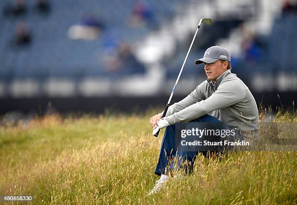 Jordan Spieth of the United States sits down on the course during a practice round ahead of the 144th Open Championship at The Old Course on July 14,...