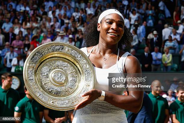 Serena Williams of United States celebrates with the trophy after winning the Final of the Ladies Singles against Garbine Muguruza of Spain during...