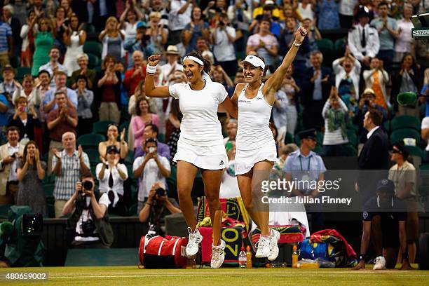 Sania Mirza of India and Martina Hingis of Switzerland celebrate after winning the Final of the Ladies Doubles against Ekaterina Makarova and Elena...
