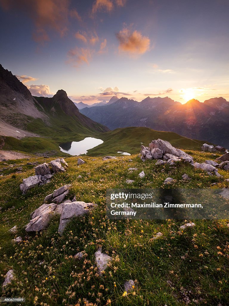 Mountain landscape with  lake at sunset.