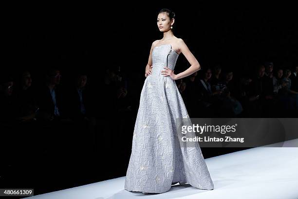 Model showcases designs on the catwalk during the LIANVIS Lian Huiqing Collection show of Mercedes-Benz China Fashion Week Autumn/Winter 2014/2015 at...
