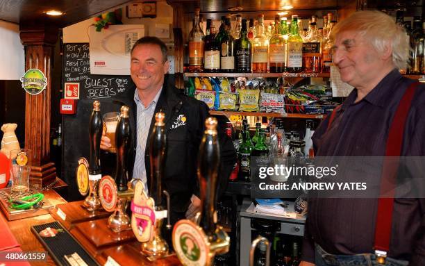 Multi time Tour De France winner Bernard Hinault samples a beer in the Robin Hood Inn at Cragg Vale, England's longest continuous uphill climb and...