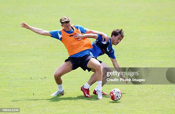 Shinji Okazaki hold off Jack Barmby during the Leicester City training session at their pre-season training camp on July 14, 2015 in Spielfeld,...