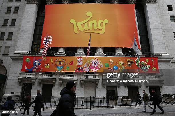 Banner for the mobile gaming company King is seen outside the New York Stock Exchange during King's initial public offering on March 26, 2014 in New...
