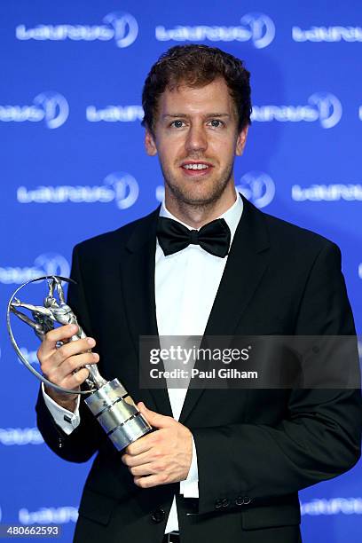 Laureus World Sportsman of the Year winner Sebastian Vettel of Germany poses with his trophy during the Winners Photocall for the 2014 Laureus World...