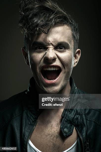 young man in leather jacket shouting at camera - chest hair stock pictures, royalty-free photos & images