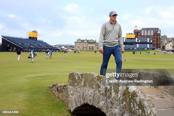 Jordan Spieth of the United States walks across Swilcan Bridge during practice ahead of the 144th Open Championship at The Old Course on July 14,...