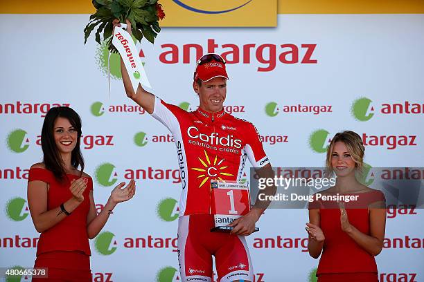 Kenneth Vanbilsen of Belgium and Cofidis, Solutions Credits celebrates after being presented with the award for the most aggressive rider during...