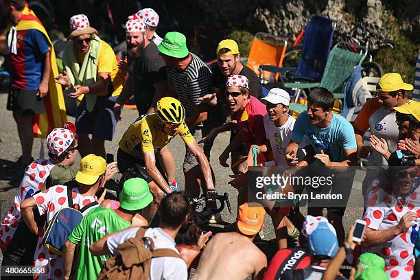 Chris Froome of Great Britain and Team Sky rides past fans as he climbs the Col de Soudet during stage ten of the 2015 Tour de France, a 167 km stage...