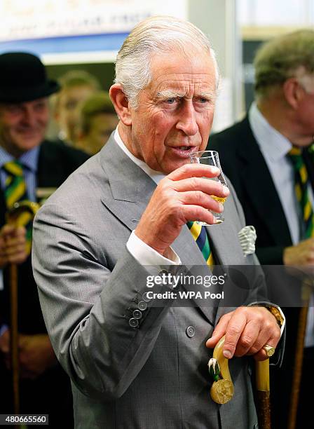 Prince Charles, Prince of Wales enjoys a drink as he attends The Great Yorkshire Show on July 14, 2015 in Harrogate, England.