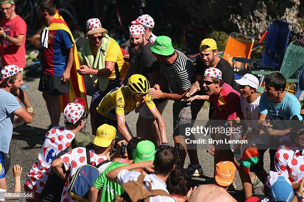 Chris Froome of Great Britain and Team Sky rides past fans as he climbs the Col de Soudet during stage ten of the 2015 Tour de France, a 167 km stage...