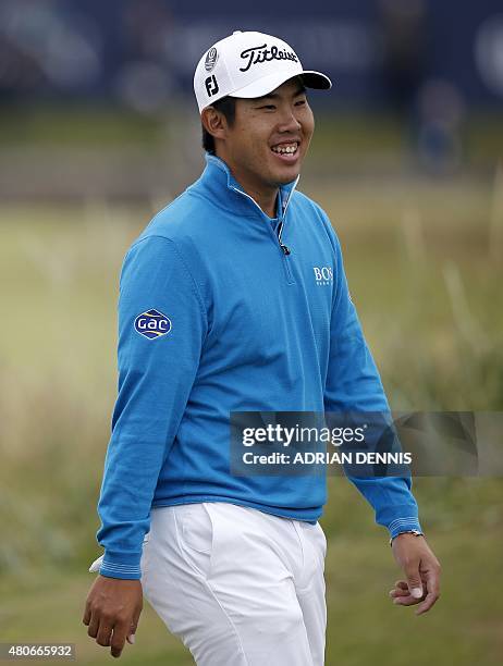 South Korea's An Byeong-Hun smiles during practice on The Old Course at St Andrews in Scotland, on July 14 ahead of The 2015 Open Golf Championship...