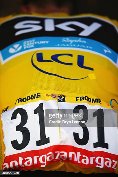 Chris Froome of Great Britain and Team Sky, wearing the overall leader's jersey, prepares for the start of stage ten of the 2015 Tour de France, a...