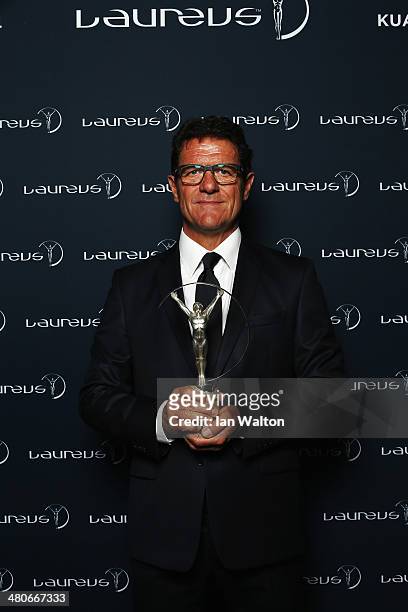 Fabio Capello poses with the trophy during the 2014 Laureus World Sports Awards at the Istana Budaya Theatre on March 26, 2014 in Kuala Lumpur,...