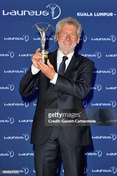 Paul Breitner on behalf of Bayern Munich winners of the Laureus World Team of the Year award poses with their trophy/speaks at the winners press...