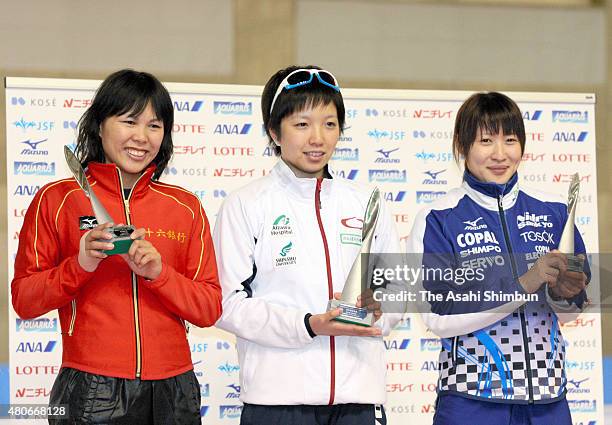 Second place Maki Tsuji, winner Nao Kodaira and third place Yukana Nishina pose during the award ceremony for the Women's Sprint during day two of...