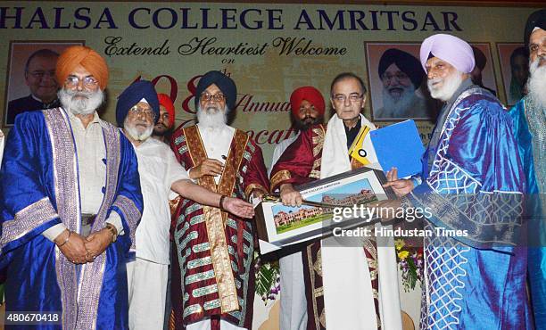 Arun Jaitley, Union Finance Minister, being honoured by Parkash Singh Badal, Chief Minister of Punjab, Satyajit Singh Majithia , Chairman Governing...