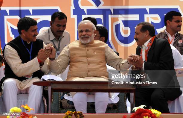 Prime ministerial candidate Narendra Modi conversating with both Bhartiya Janta Party nominated candidates for upcoming Parliamentry elections 2014...