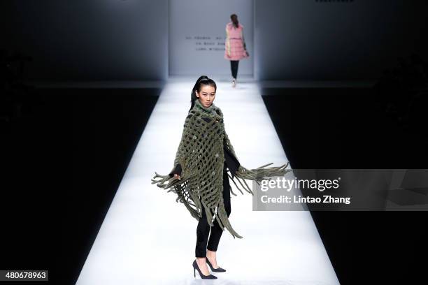 Models showcases designs on the catwalk during the Fur Fashion Collection show of Mercedes-Benz China Fashion Week Autumn/Winter 2014/2015 at the...