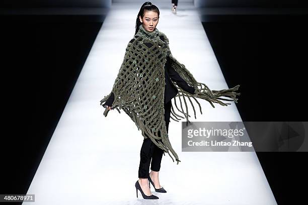 Model showcases designs on the catwalk during the Fur Fashion Collection show of Mercedes-Benz China Fashion Week Autumn/Winter 2014/2015 at the...
