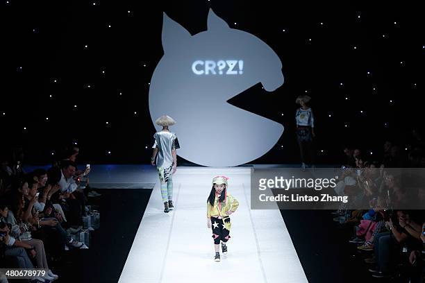 Young model showcases designs on the catwalk during the CRZ Collection show of Mercedes-Benz China Fashion Week Autumn/Winter 2014/2015 at the...