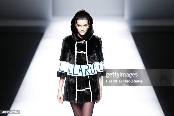 Model showcases designs on the catwalk during the Fur Fashion Collection show of Mercedes-Benz China Fashion Week Autumn/Winter 2014/2015 at the...