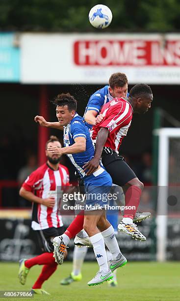 Michael Rankine of Altrincham tangles with Tim Chow of Wigan Athletic during the pre season friendly between Altrincham and Wigan Athletic at the J...