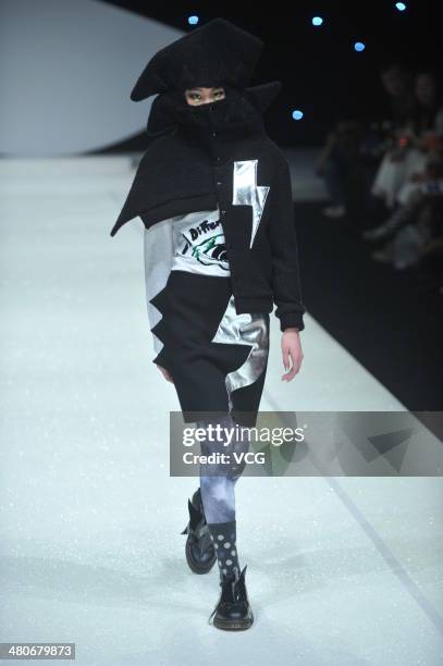 Model showcases designs on the runway during the CRZ Collection show on day two of the Mercedes-Benz China Fashion Week Autumn/Winter 2014/2015 at...