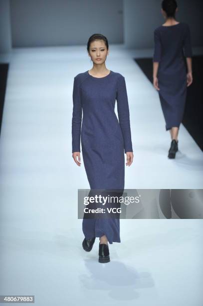 Model showcases designs on the runway during the LIANVIS Lian Huiqing Collection show on day two of the Mercedes-Benz China Fashion Week...