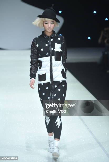 Model showcases designs on the runway during the CRZ Collection show on day two of the Mercedes-Benz China Fashion Week Autumn/Winter 2014/2015 at...