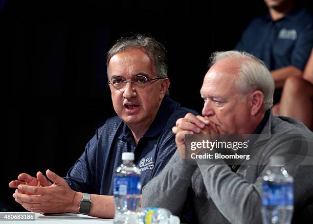 Sergio Marchionne, chief executive officer of Fiat Chrysler Automobiles NV , left, speaks with Dennis Williams, president of the United Auto Workers...