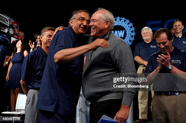 Sergio Marchionne, chief executive officer of Fiat Chrysler Automobiles NV , left, and Dennis Williams, president of the United Auto Workers union ,...