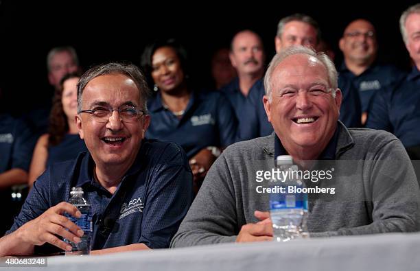 Sergio Marchionne, chief executive officer of Fiat Chrysler Automobiles NV , left, and Dennis Williams, president of the United Auto Workers union ,...