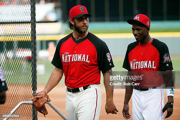National League All-Star Madison Bumgarner of the San Francisco Giants speaks with National League All-Star Dee Gordon of the Miami Marlins prior...