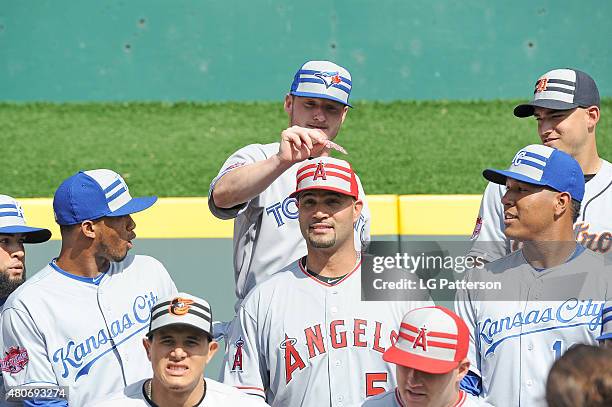 American League All-Star Josh Donaldson of the Toronto Blue Jays attempts to put a gum wrapper on to the hat of American League All-Star Albert...