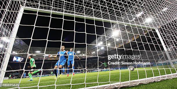 Fabian Johnson and Tobias Strobl of Hoffenheim react as Leon Andreasen of Hannover scores his team's first goal during the Bundesliga match between...