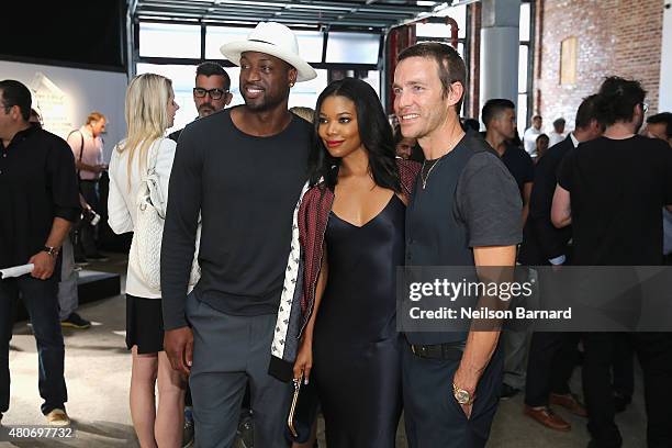 Dwyane Wade, Gabrielle Union, and Managing partner of rag & bone David Neville attend the rag & bone SS16 Menswear Event at Highline Stages on July...