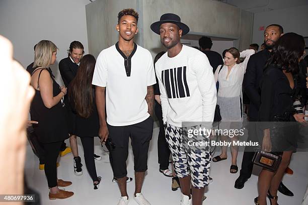 July 14: Los Angeles Lakers' s Nick Young and Miami Heat Dwyane Wade are seen during New York Fashion Week Men's on July 14, 2015 in New York, New...