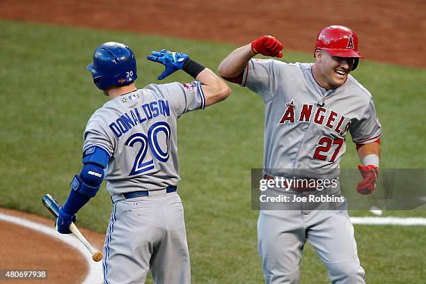 American League All-Star Mike Trout of the Los Angeles Angels of Anaheim celebrates with teammate American League All-Star Josh Donaldson of the...